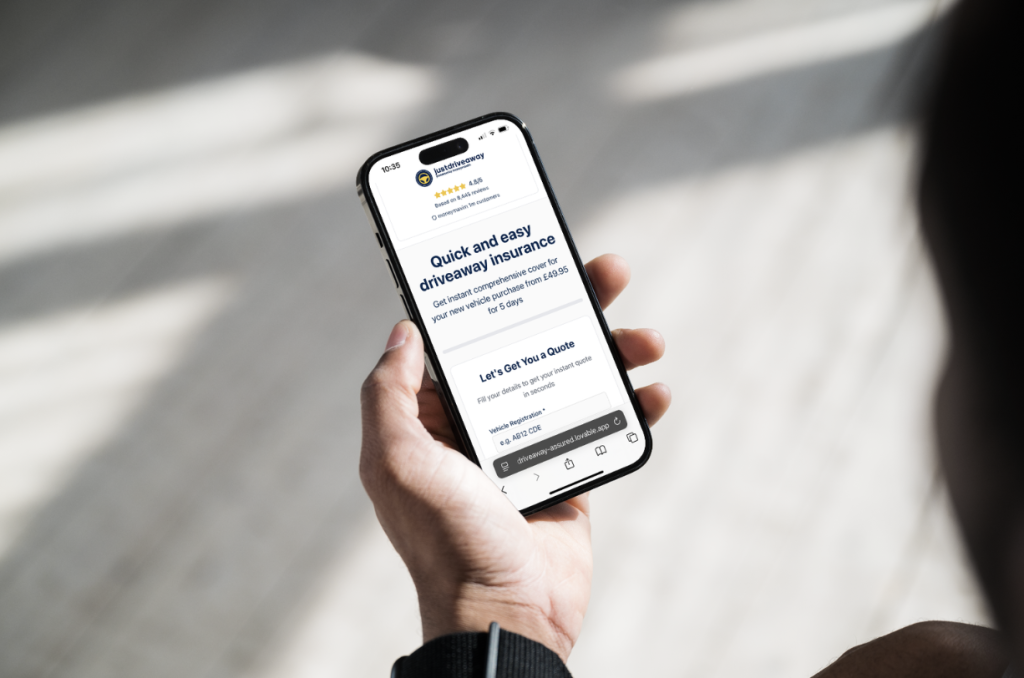 Phone screen displaying the Justdriveaway website